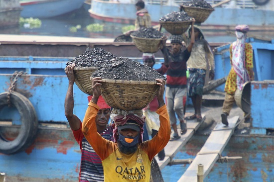 Unloading coal in Bangladesh